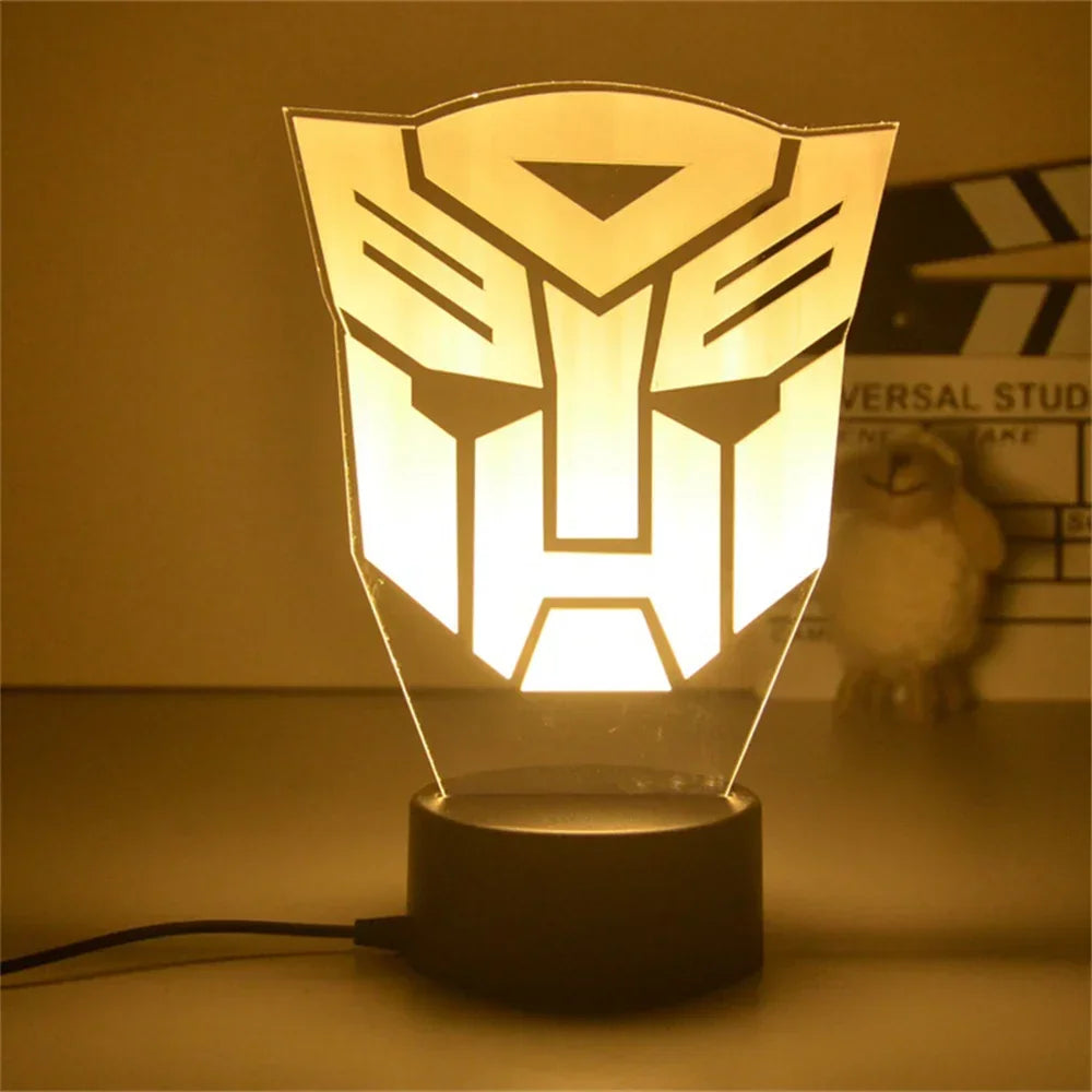 Lampe LED décorative logo Autobot jaune sur socle noir, style moderne, bureau – Transformers.