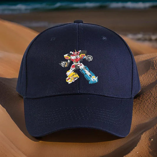 Casquette bleue avec motif robot coloré, style cartoon, posée sur un fond de plage – Transformers.